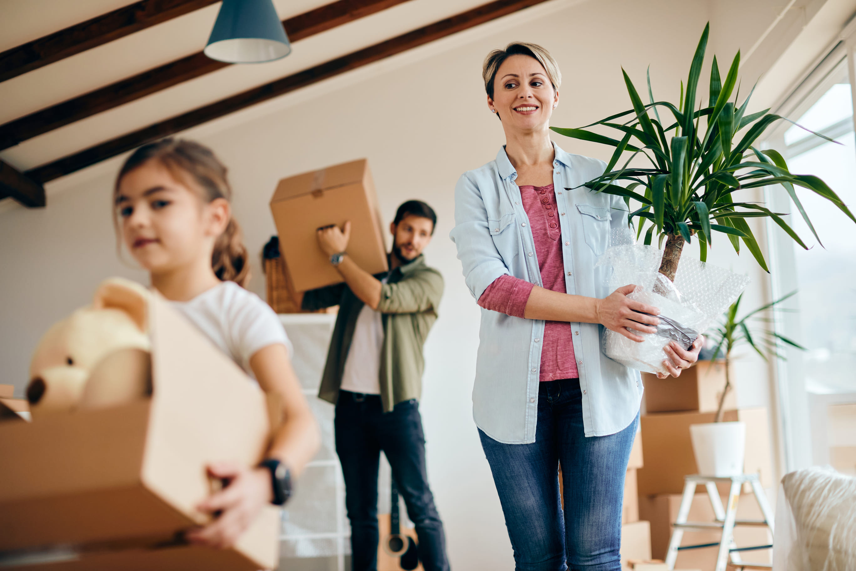 Below View Of A Family Moving Into New Home 2024 12 13 18 36 29 Utc