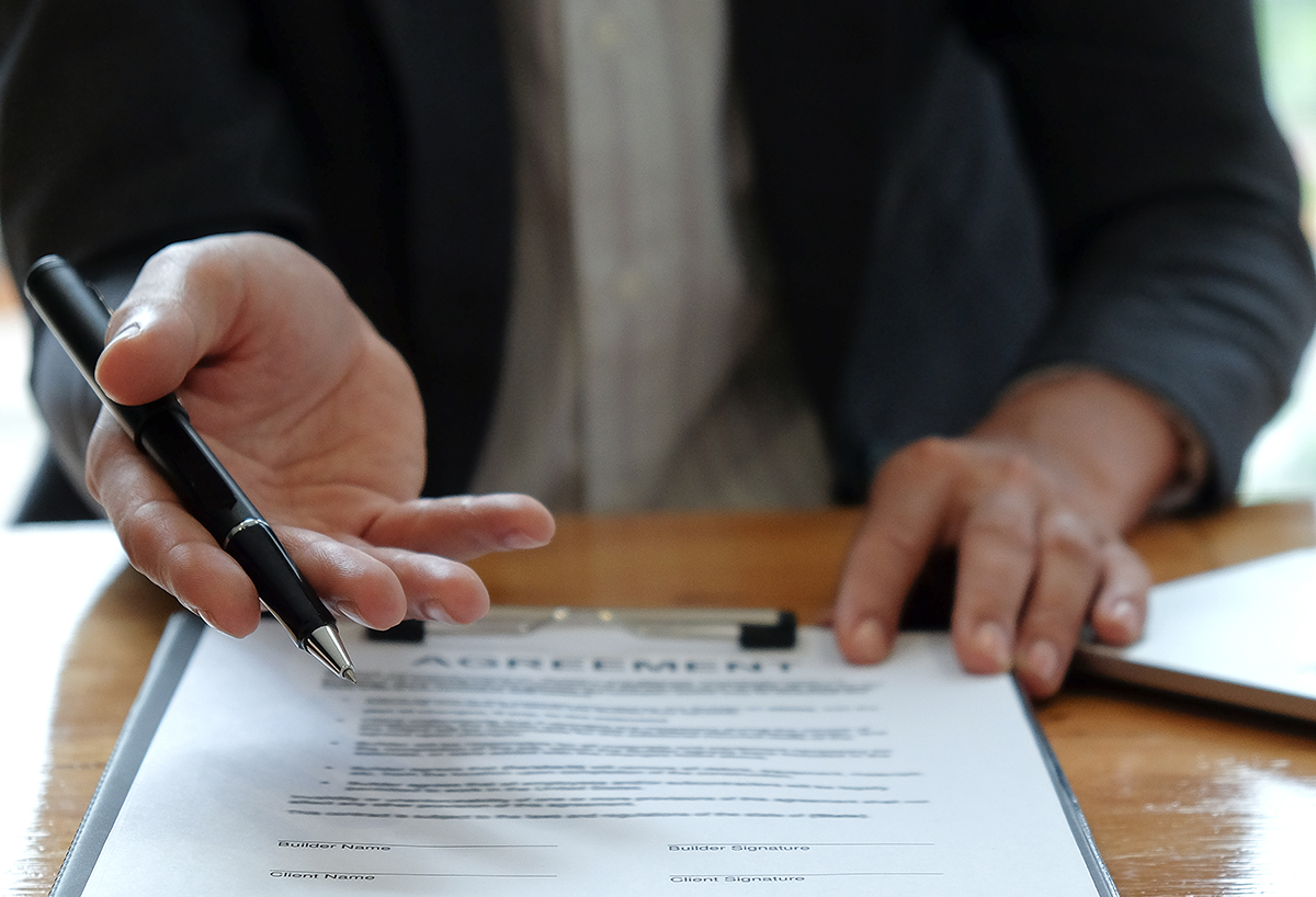 Businessmen Selling The House Pointing At Signing 2021 08 26 17 53 49 Utc